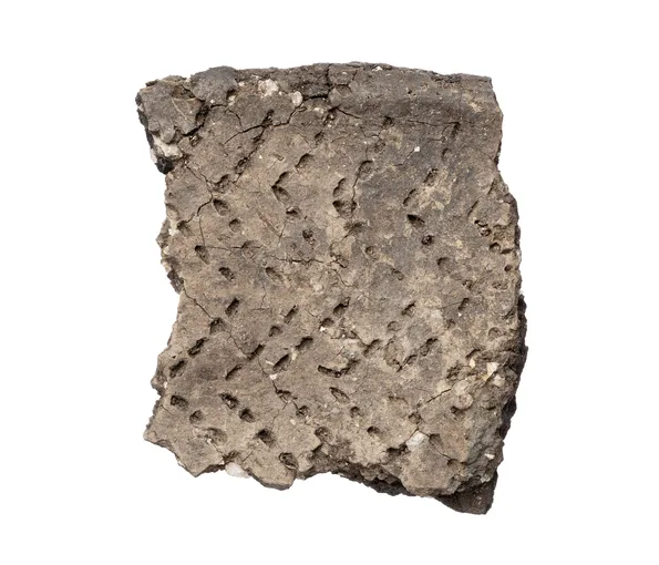 Piece of ceramic with man made zig zag patterns 